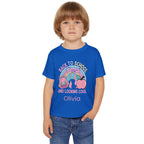 Close-up of Back to School rainbow backpack apple design with custom name on toddler tee