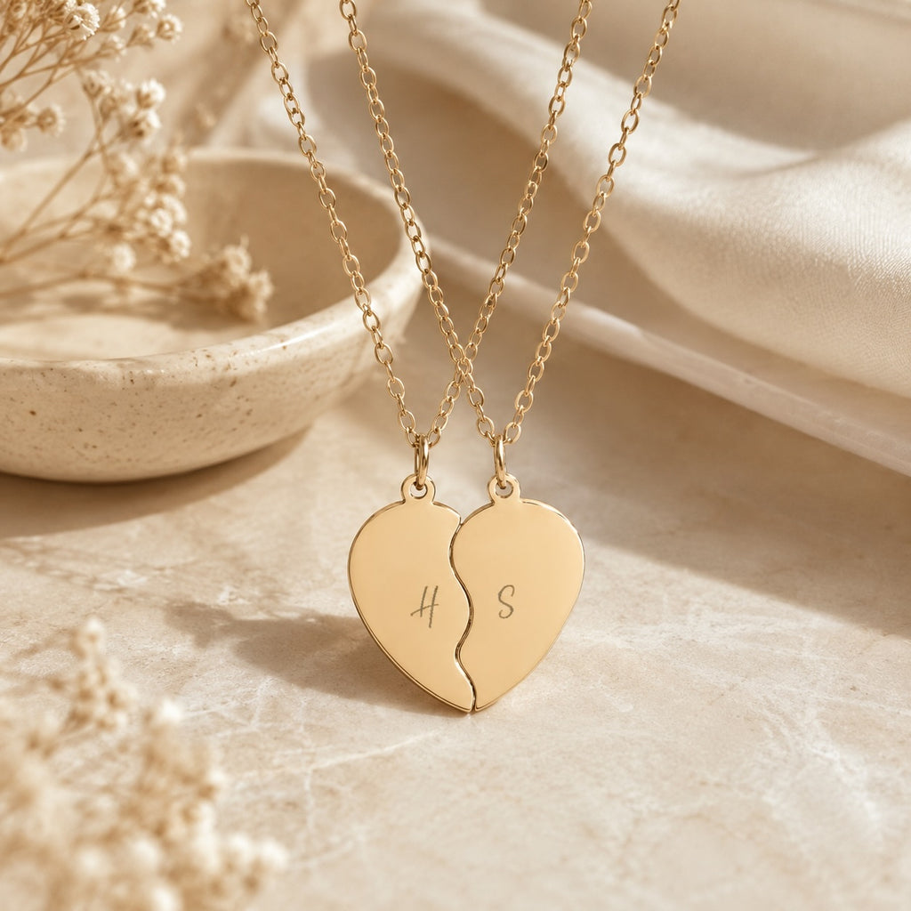 Break apart heart necklace set styled on a table with decor