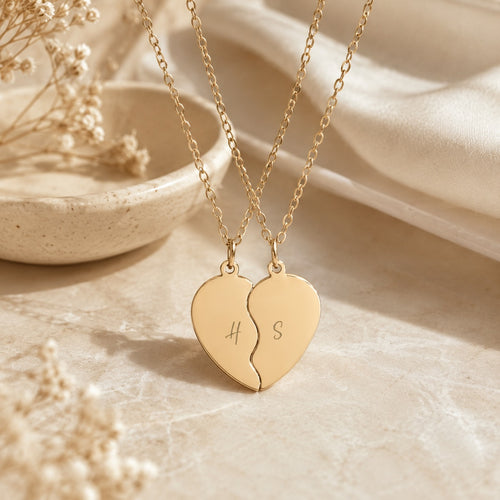 Break apart heart necklace set styled on a table with decor