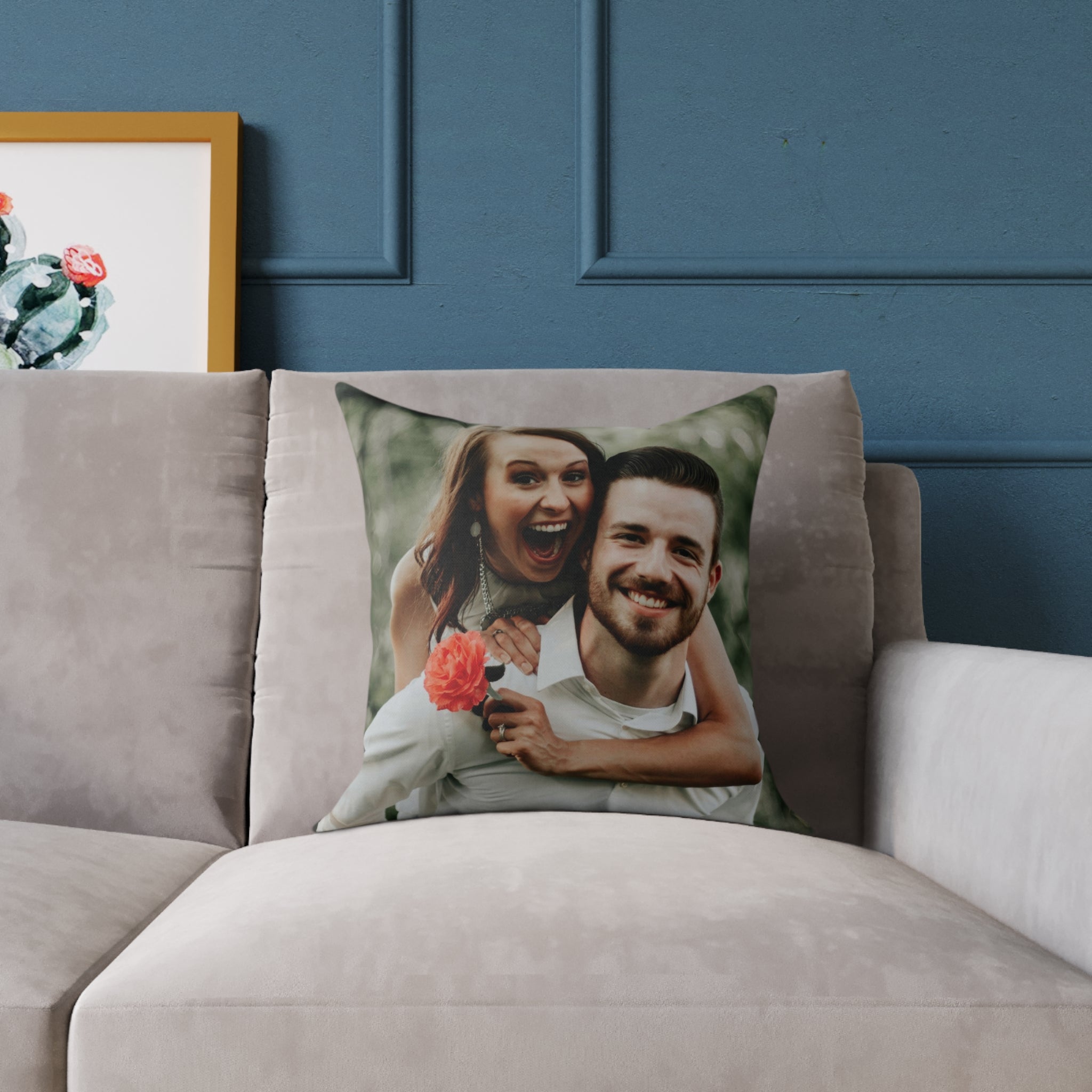 Black wedding pillow on a decorative chair in a home setting