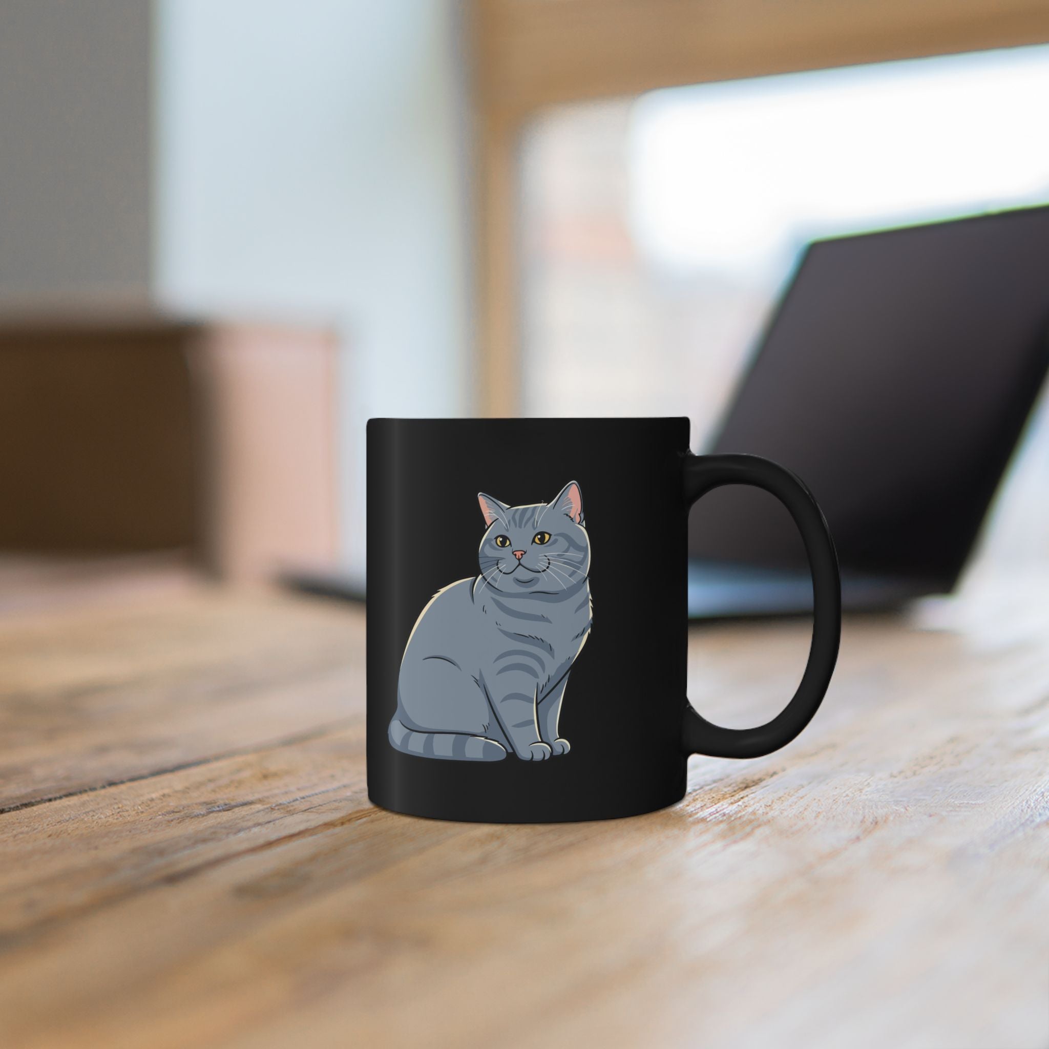 Close-up of British Shorthair cat illustration on personalised black ceramic mug