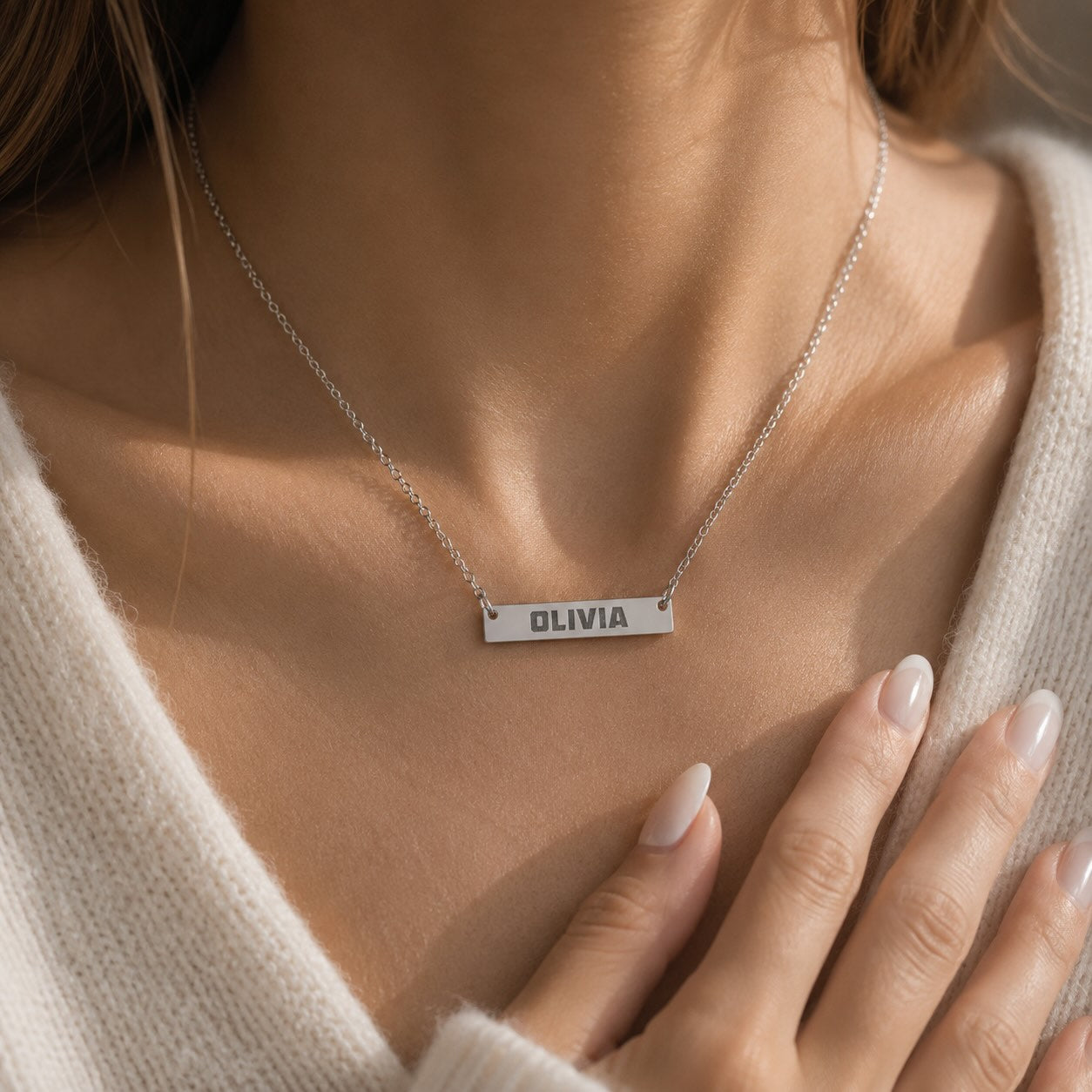 Brushed bar necklace worn around the neck