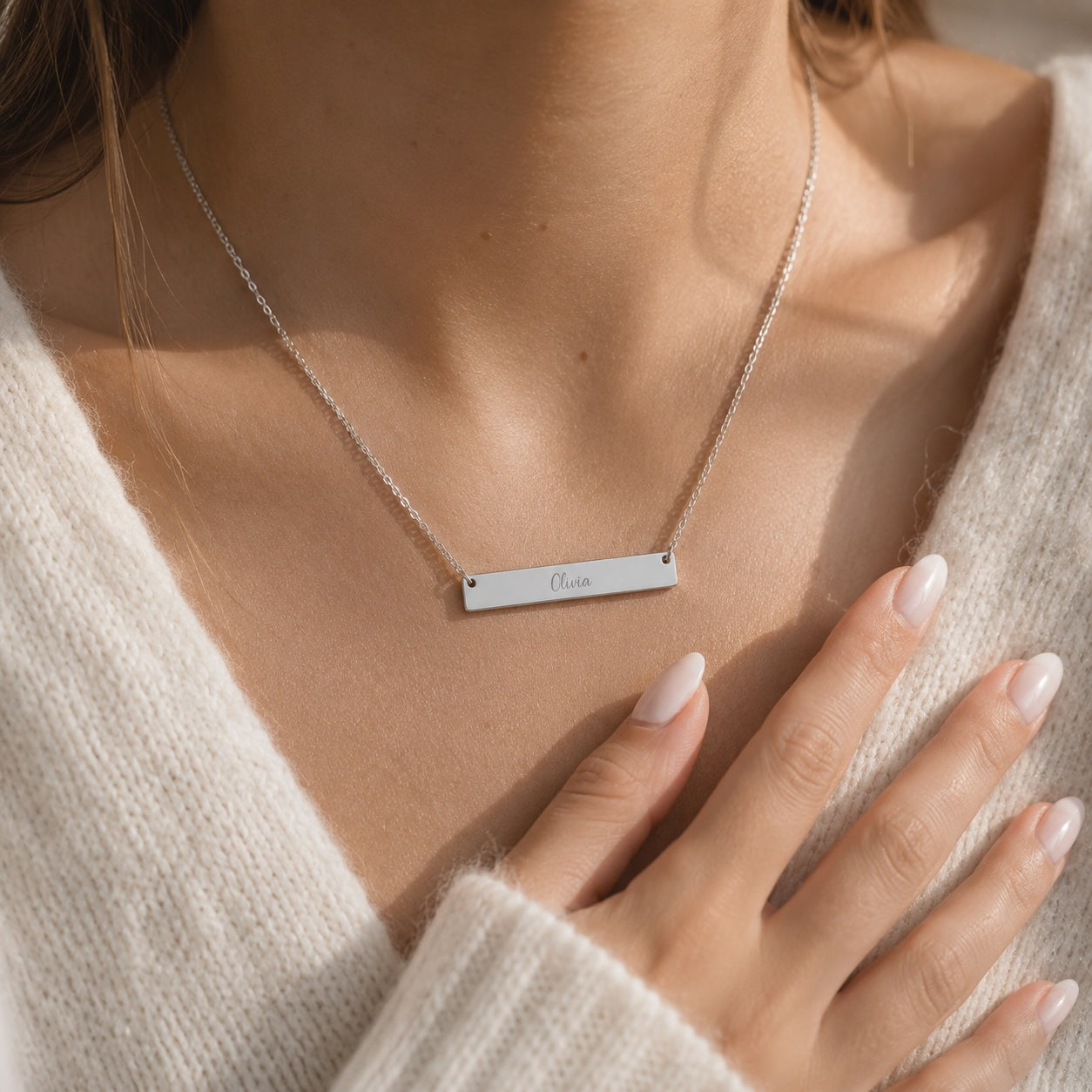 Brushed bar necklace worn around the neck