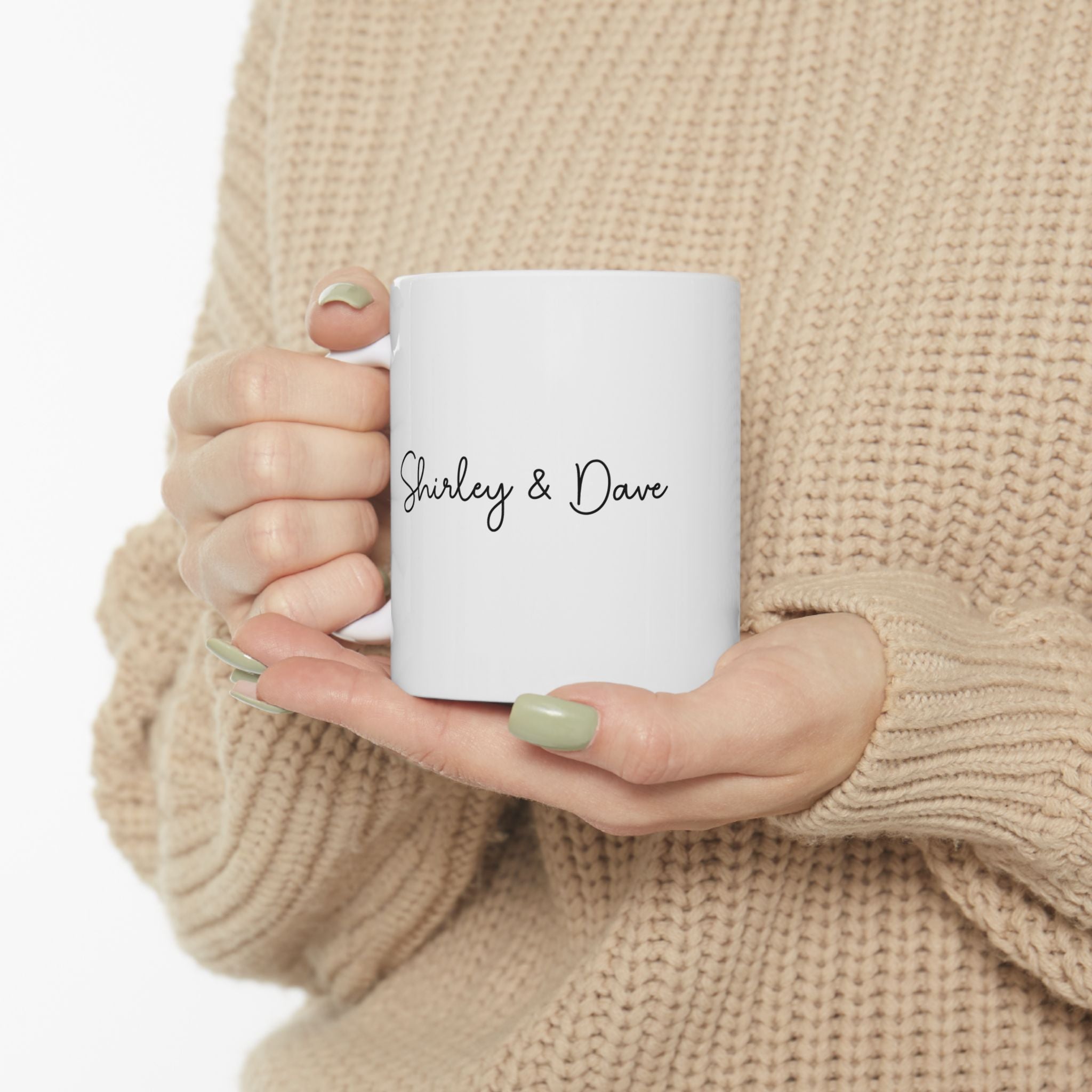 Champagne Toast mug held in hand for size reference