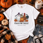 Boy wearing Chick or Treat Halloween t-shirt, side view