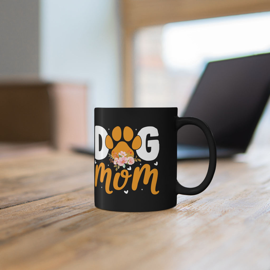 Close-up of Dog Mom paw print design on personalised black ceramic mug