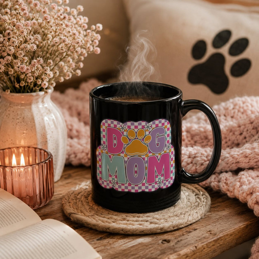 Dog Mom retro checkerboard black mug styled with pink dried flowers, candle, book, and paw print pillow