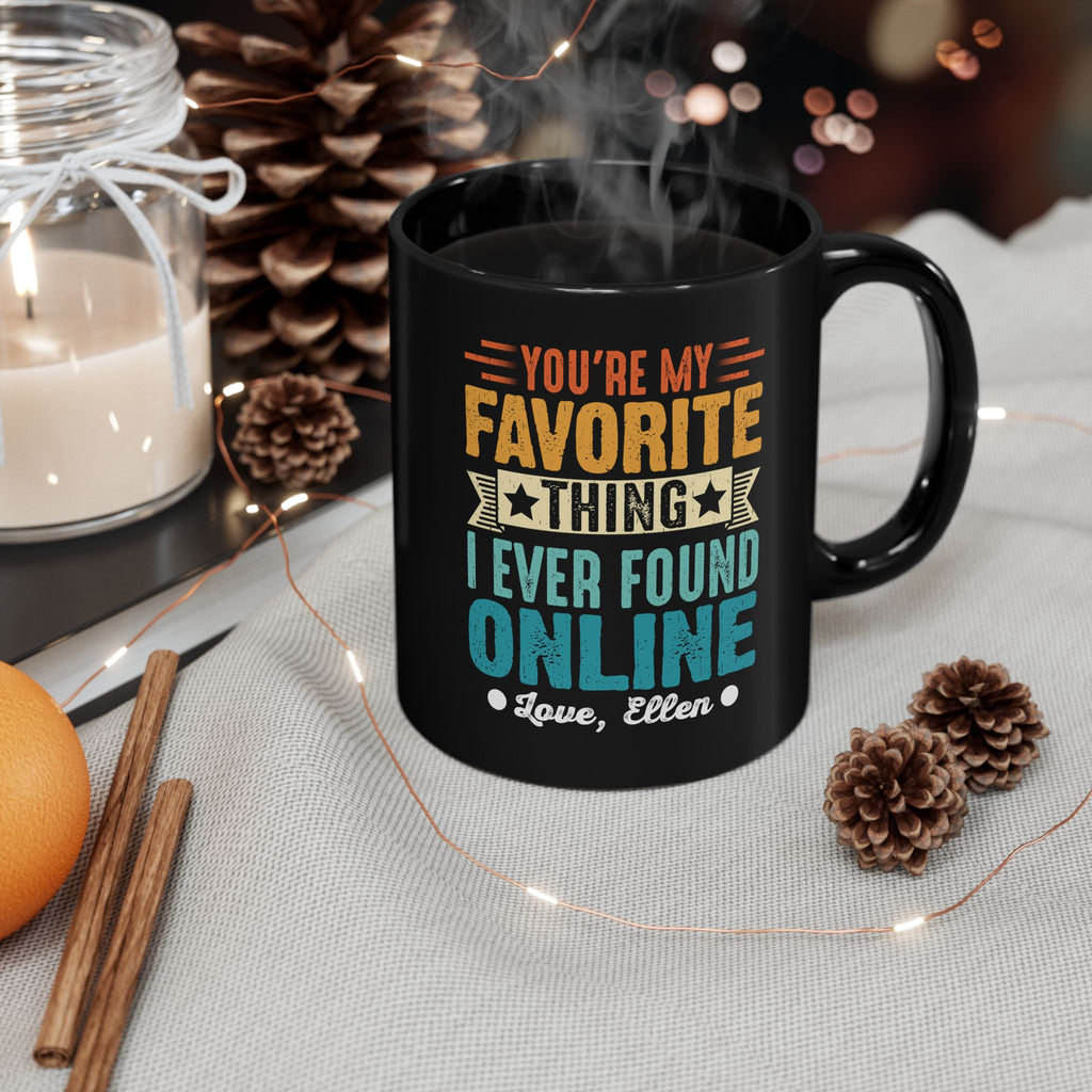 Close-up of retro lettering and custom signature on black mug