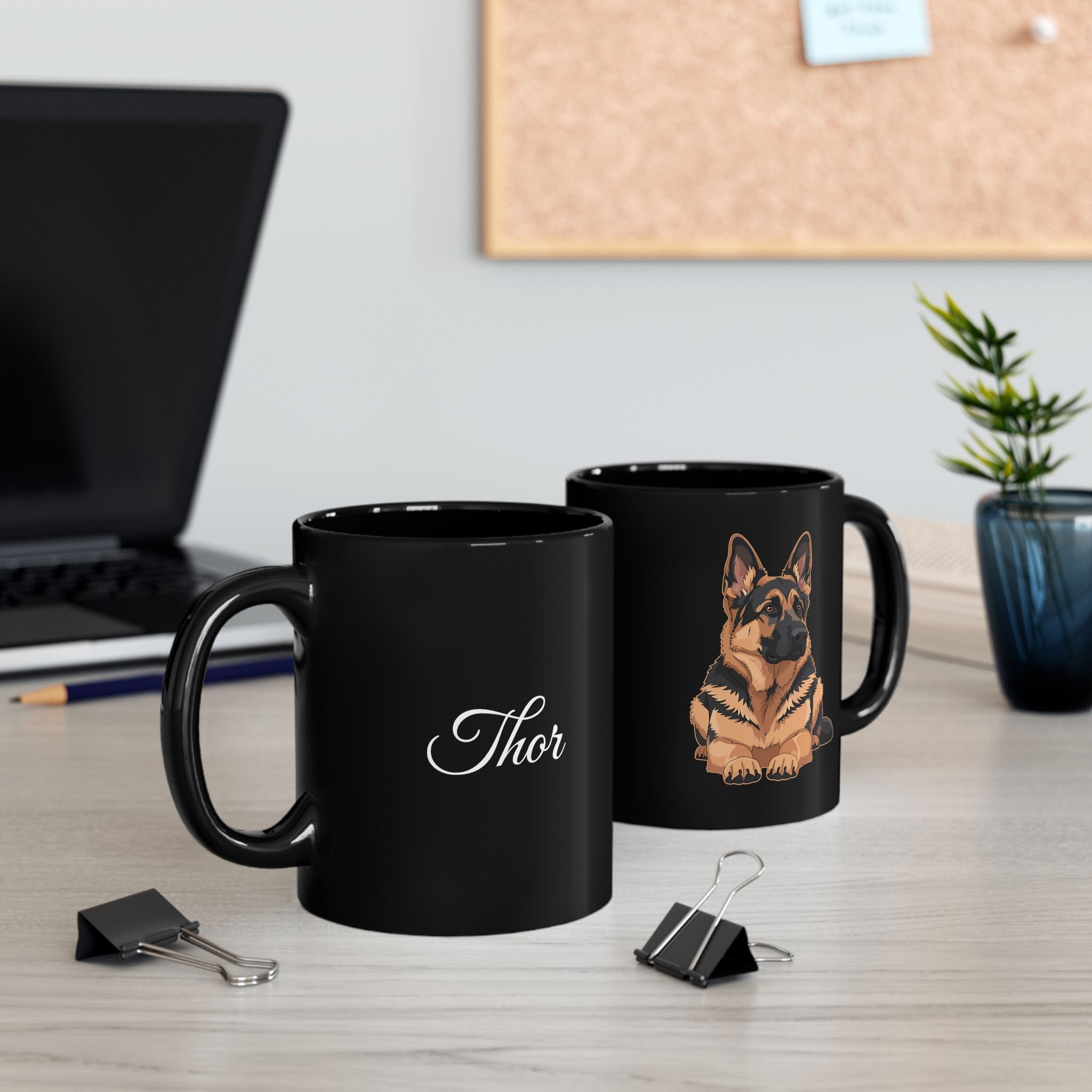 Personalised German Shepherd black mug showing both sides - custom name and GSD illustration on desk