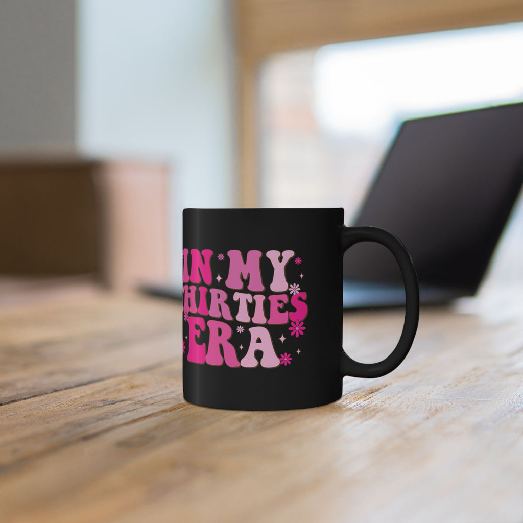 In My Thirties Era design detail on black ceramic mug
