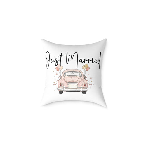 Just Married wedding cushion on a sofa – white background with pink car