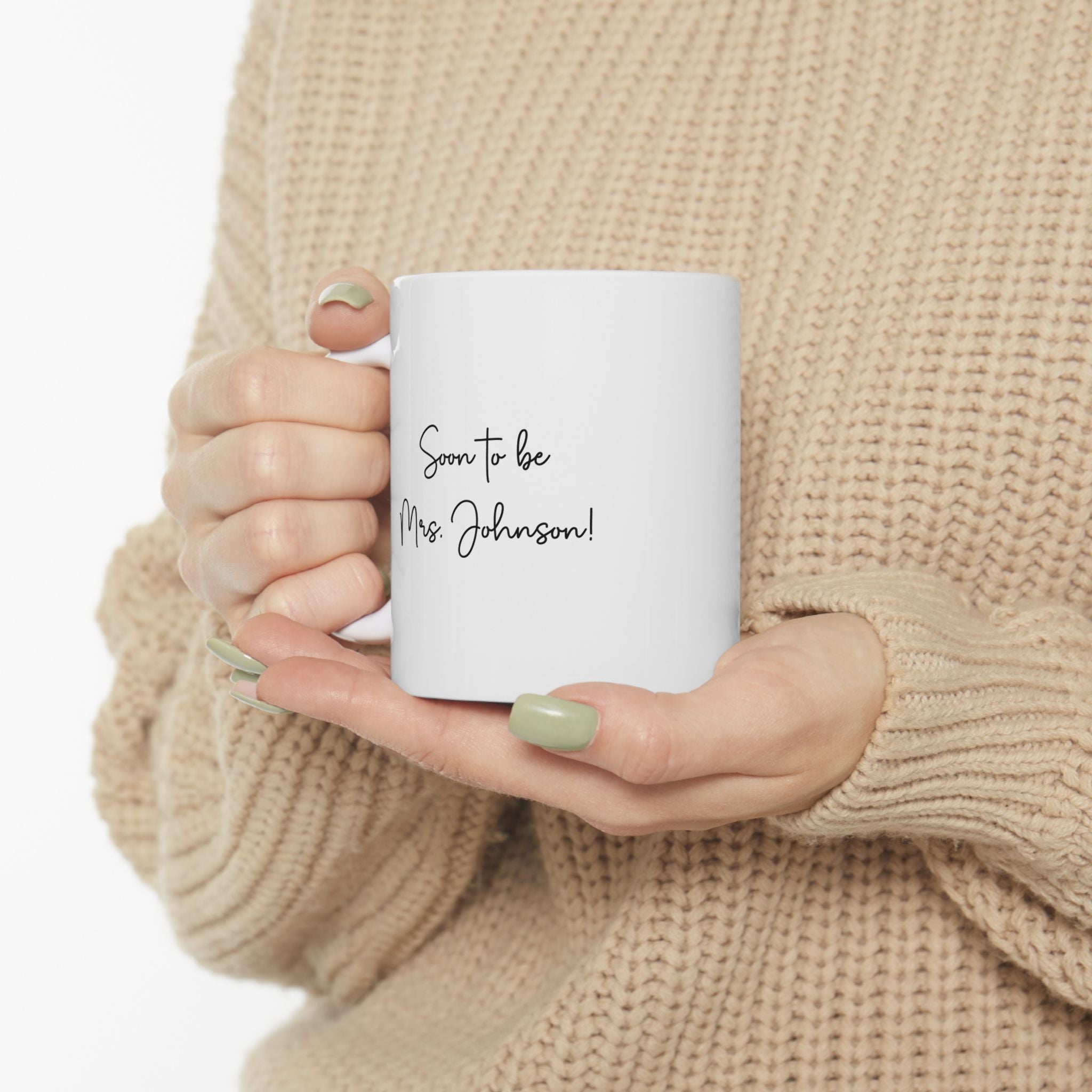 Miss to Mrs mug held in hand for size reference