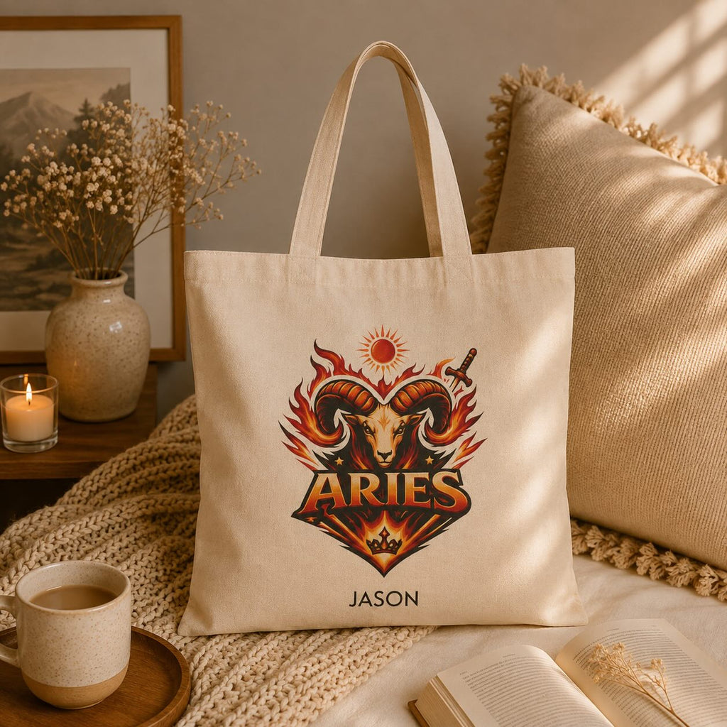 Personalized Aries zodiac tote bag styled on a tabletop with home decor