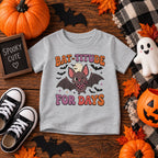 Toddler wearing personalized Bat-titude Halloween t-shirt at a Halloween party
