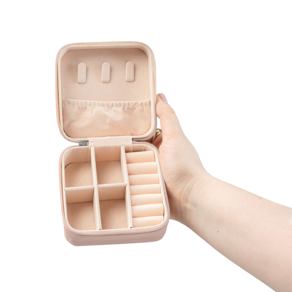 Personalized ivory butterfly jewelry travel case with custom name, held in hand