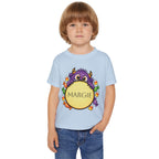 Toddler wearing personalized candy monster Halloween t-shirt at a pumpkin patch