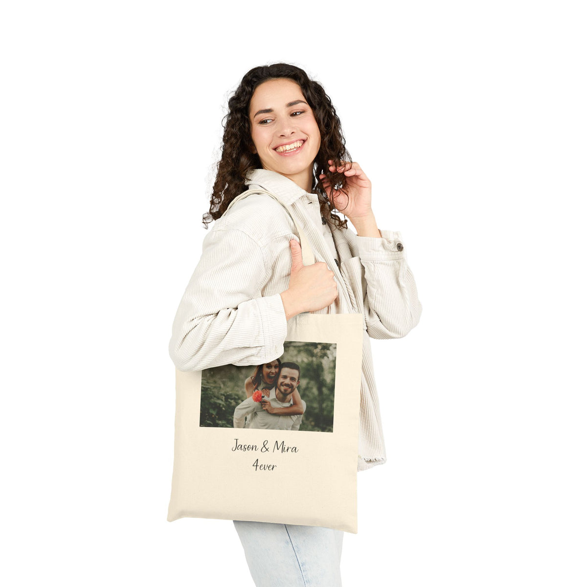 Woman carrying the personalized couple names tote bag on her shoulder