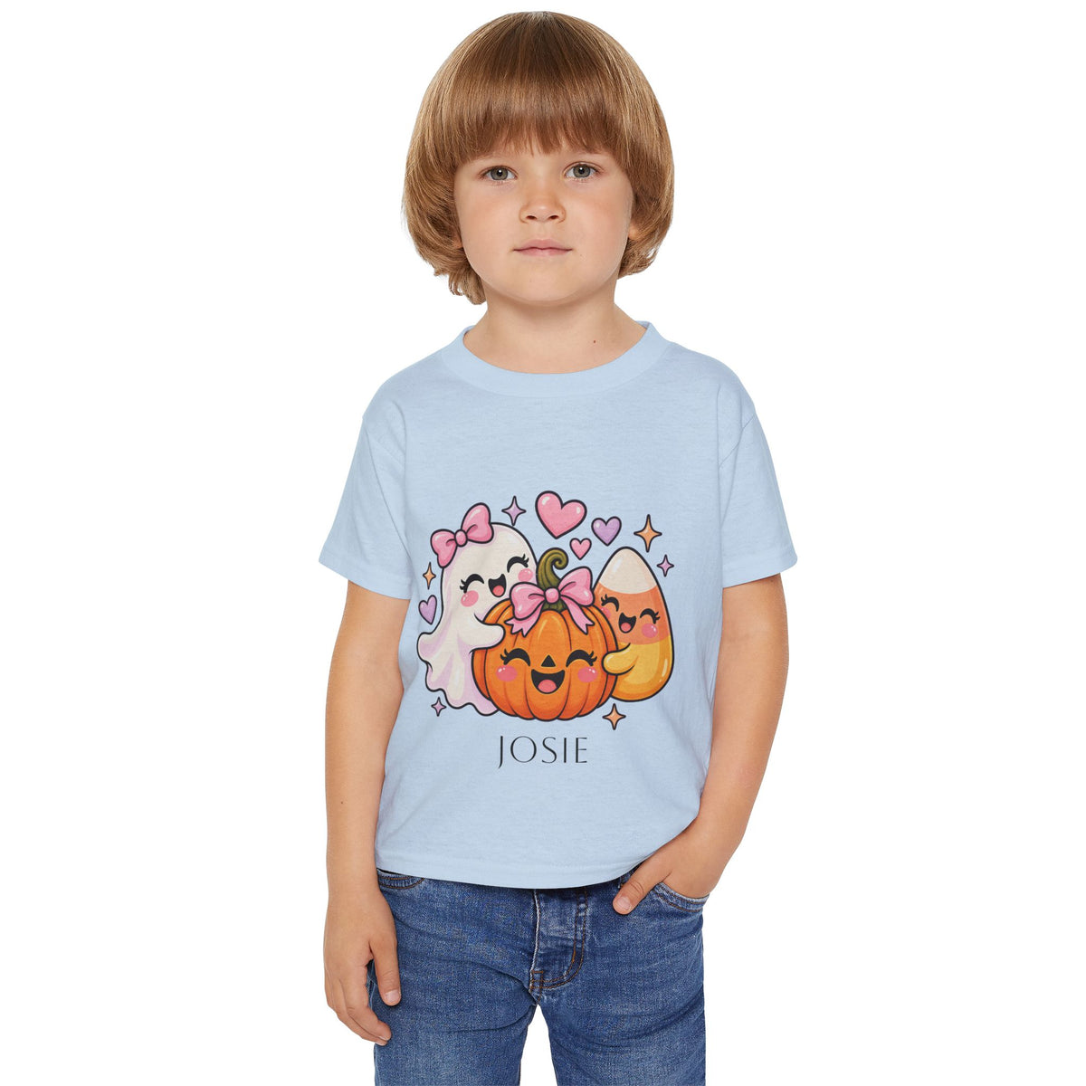 Toddler wearing personalized ghost and pumpkin Halloween t-shirt at a pumpkin patch
