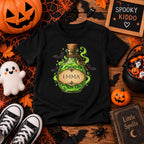 Kid wearing personalized magic potion Halloween t-shirt at home