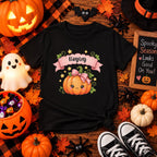 Kid wearing personalized cute pumpkin Halloween t-shirt at home