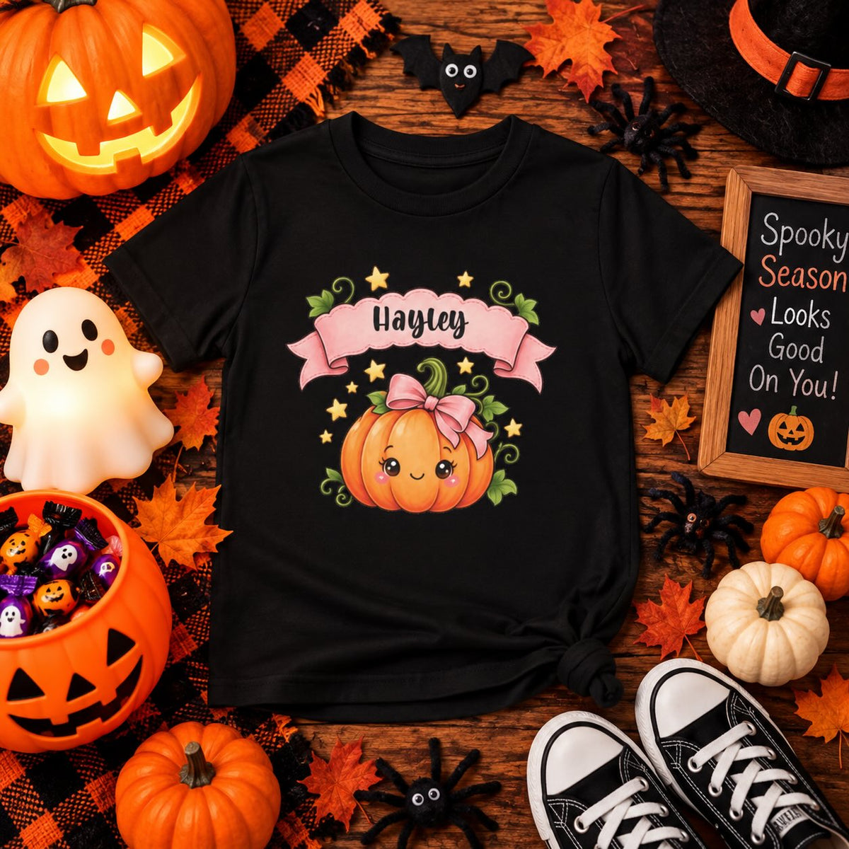 Kid wearing personalized cute pumpkin Halloween t-shirt at home