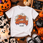Girl wearing personalized Stay Spooky Halloween t-shirt