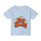 Toddler girl wearing personalized Stay Spooky Halloween t-shirt, front view