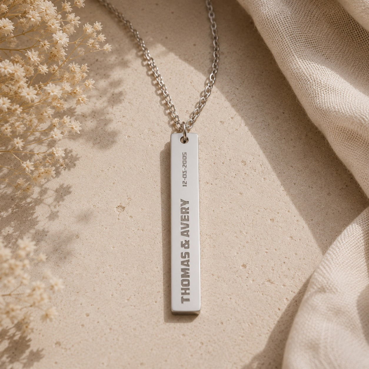 Polished bar necklace worn around the neck